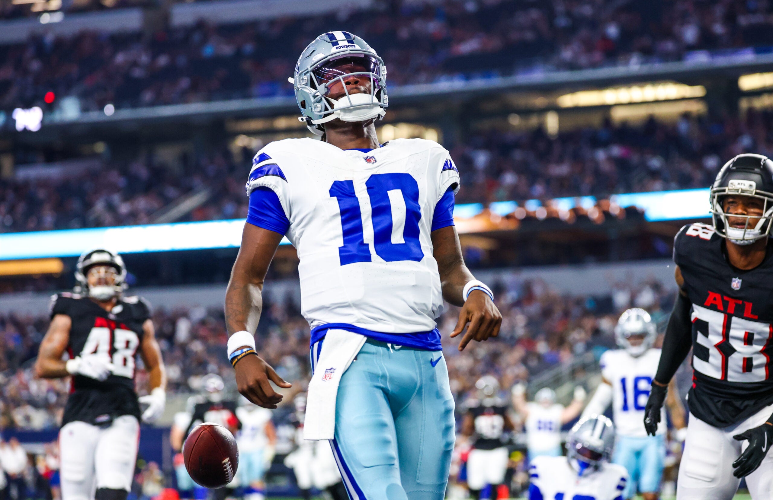 Aug 22, 2025; Arlington, Texas, USA; Dallas Cowboys quarterback Joe Milton III (10) reacts after scoring a touchdown during the first quarter against the Atlanta Falcons at AT&T Stadium.