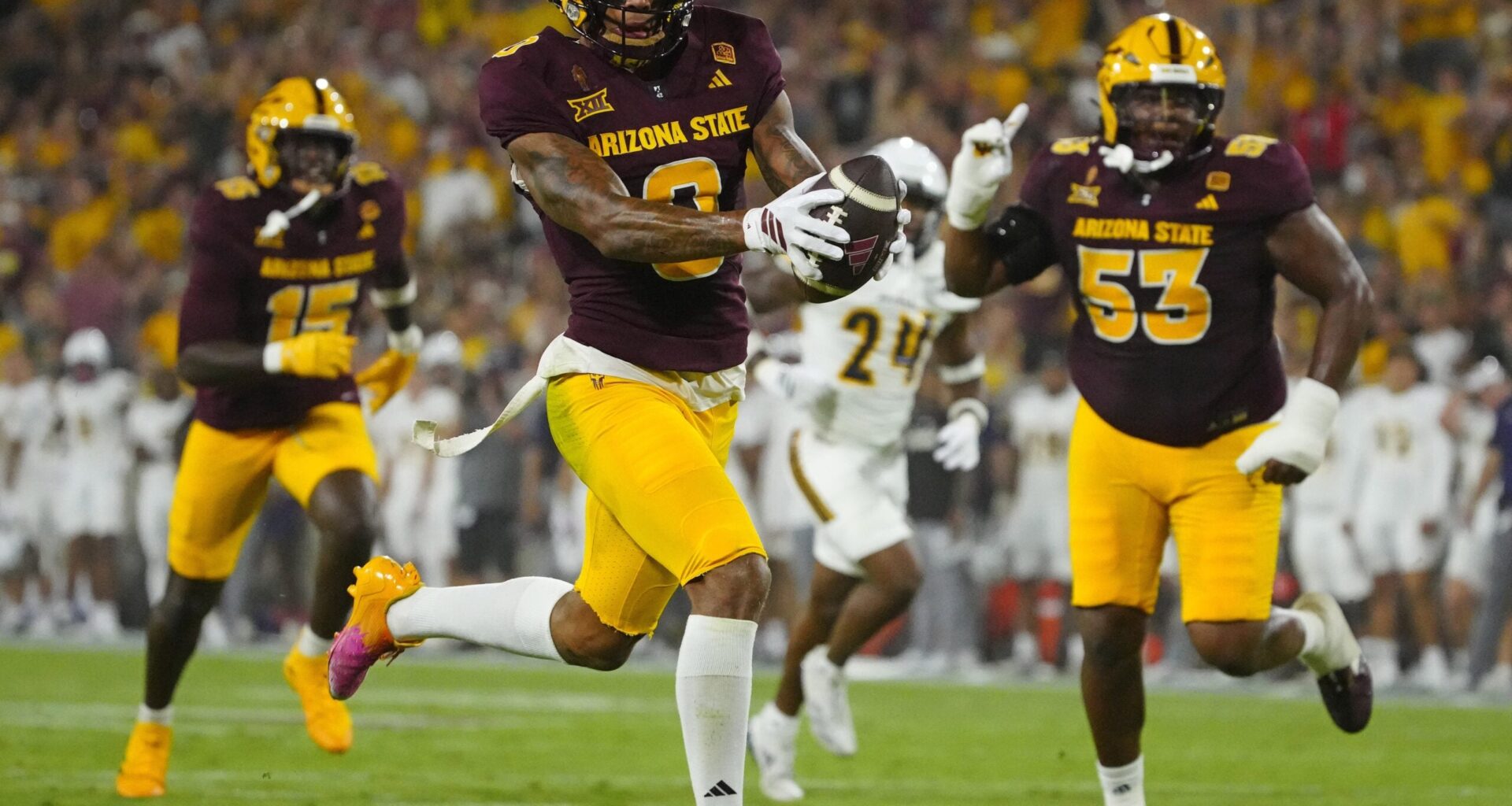 Arizona State wide receiver Jordyn Tyson (0) scores a touchdown against NAU during a game at Mountain America Stadium in Tempe on Aug. 30, 2025.