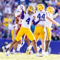 Nov 15, 2025; Baton Rouge, Louisiana, USA; LSU Tigers cornerback Mansoor Delane (4) reacts to a stop on fourth down against the Arkansas Razorbacks during the second half at Tiger Stadium.