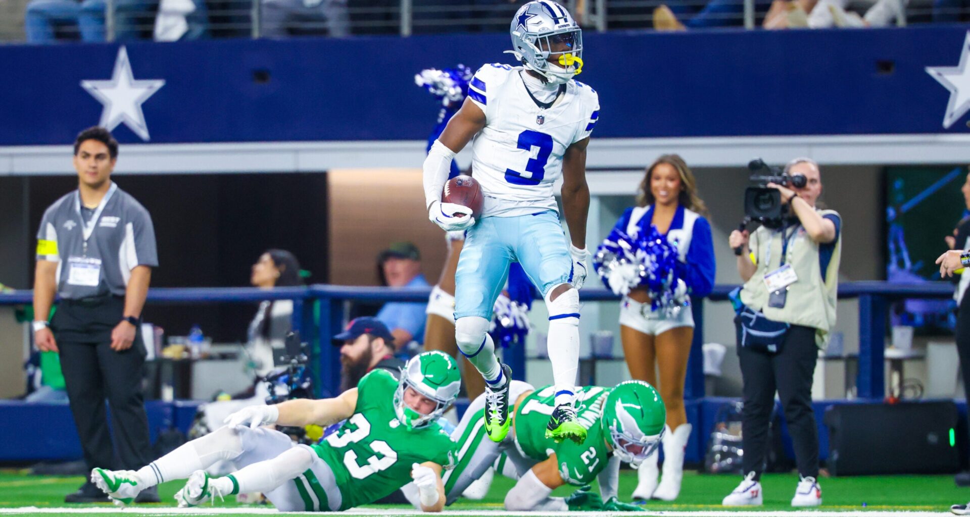 Nov 23, 2025; Arlington, Texas, USA; Dallas Cowboys wide receiver George Pickens (3) reacts after making a catch over Philadelphia Eagles cornerback Cooper DeJean (33) and Philadelphia Eagles safety Sydney Brown (21) during the game at AT&T Stadium.
