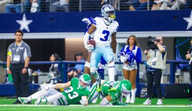 Nov 23, 2025; Arlington, Texas, USA; Dallas Cowboys wide receiver George Pickens (3) reacts after making a catch over Philadelphia Eagles cornerback Cooper DeJean (33) and Philadelphia Eagles safety Sydney Brown (21) during the game at AT&T Stadium.