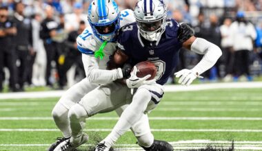 Detroit Lions cornerback Amik Robertson (21) tackles Dallas Cowboys wide receiver George Pickens (3) during the first half at Ford Field in Detroit on Thursday, Dec. 4, 2025.
