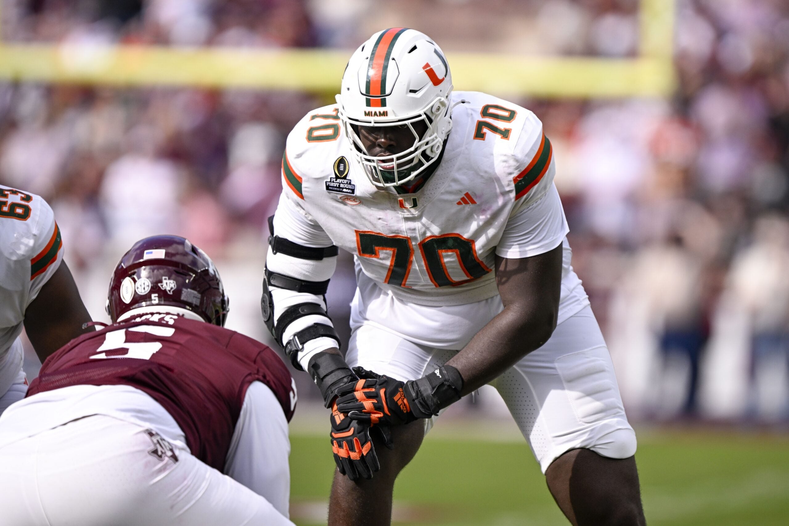 Dec 20, 2025; College Station, TX, USA; Miami Hurricanes offensive lineman Markel Bell (70) gets into position during the game between the Aggies and the Hurricanes at Kyle Field. Mandatory Credit: Jerome Miron-Imagn Images