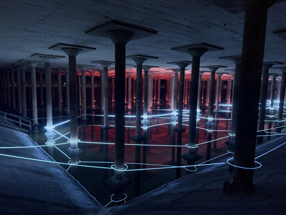Red and white LED lights connect a network of pillars underground