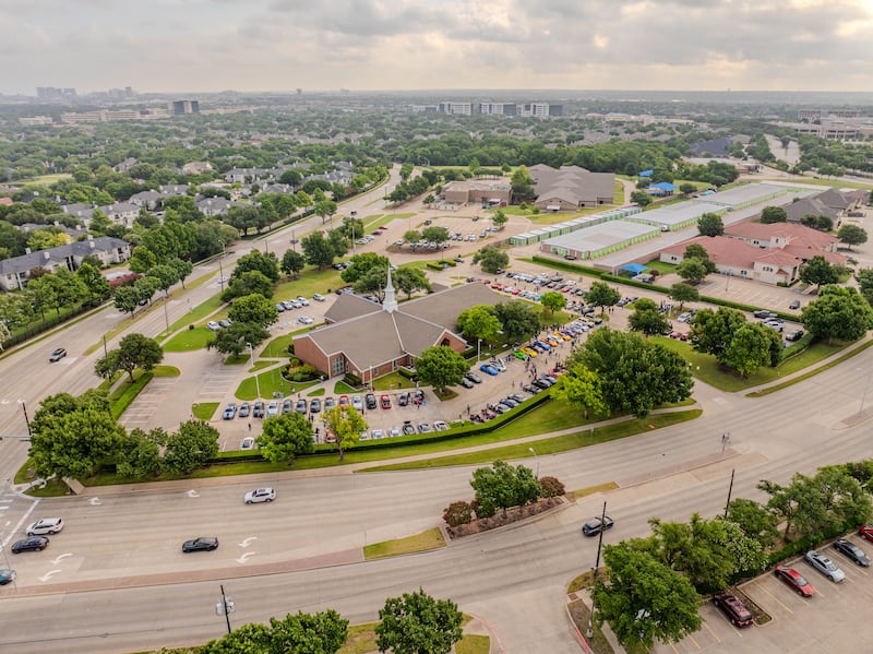 A drone shot shows dozens of classic cars parked by a meetinghouse in Plano, Texas, on Saturday morning, Feb. 7, 2026, for a monthly "Cars and Christ" event for the community.