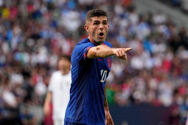 United States' Christian Pulisic points during the first half of an international friendly against Uzbekistan on Sept. 9, 2023, in St. Louis. (AP Photo/Jeff Roberson)