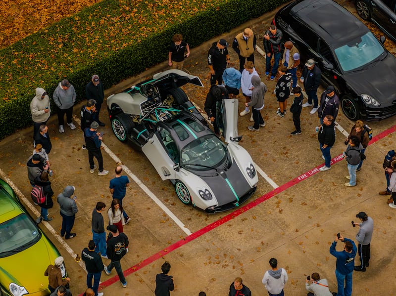 People view classic cars in the parking lot of a Latter-day Saint meetinghouse in Plano, Texas, on Saturday morning, Feb. 7, 2026, during a monthly "Cars and Christ" event.