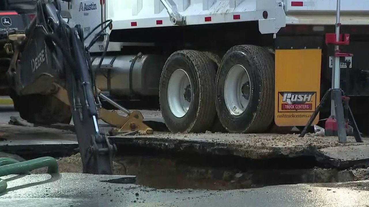 Hole in ground after water main break