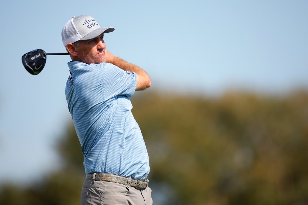 Brendon Todd swings a golf club from the 12th tee.