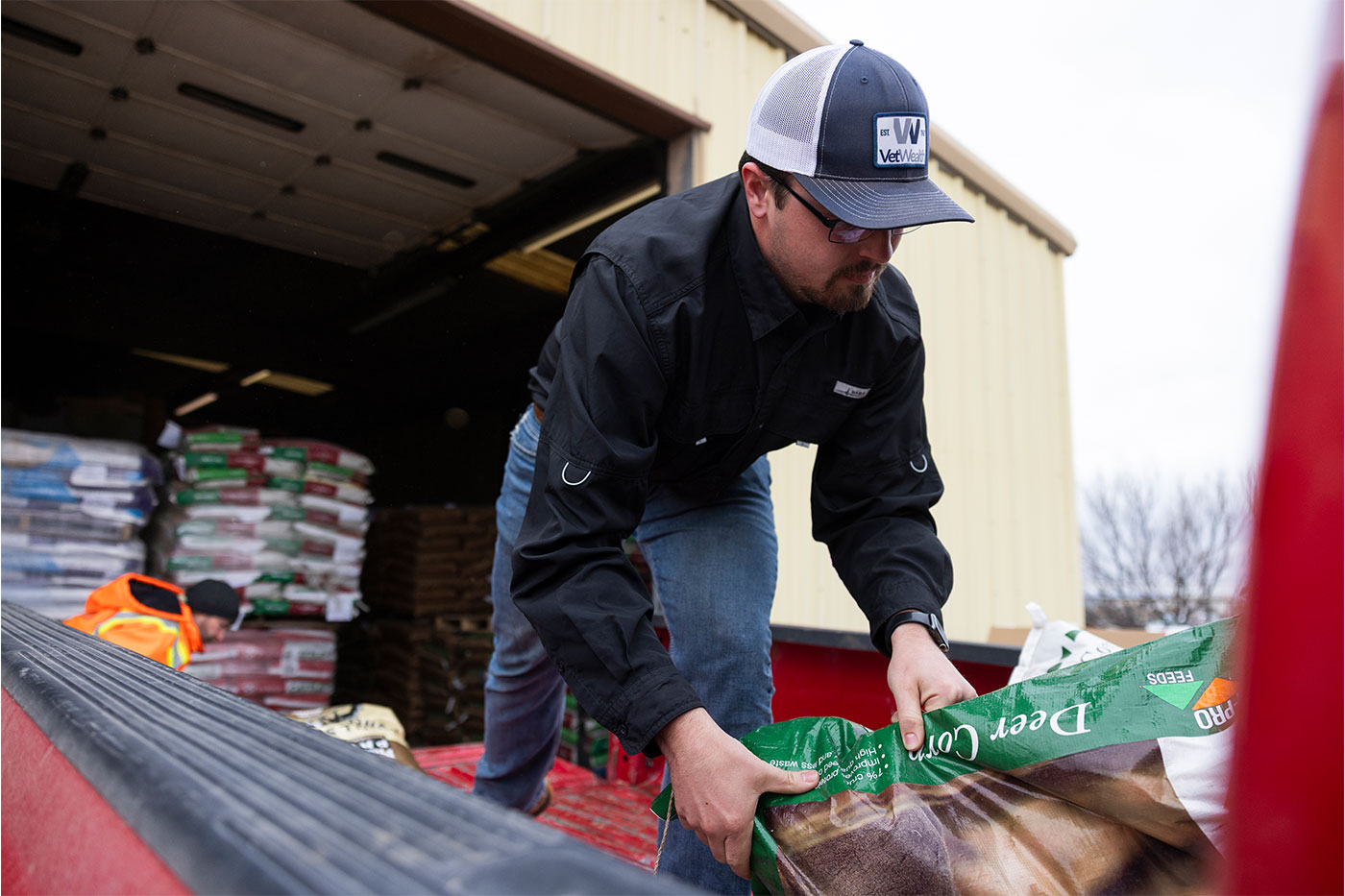 Tommy loading a truck of relief supply