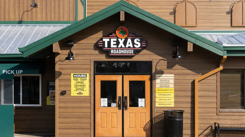 The entrance to a Texas Roadhouse during the day