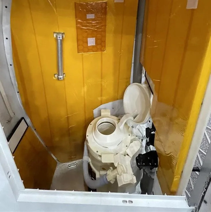 A model of the Artemis II toilet similar to the one onboard