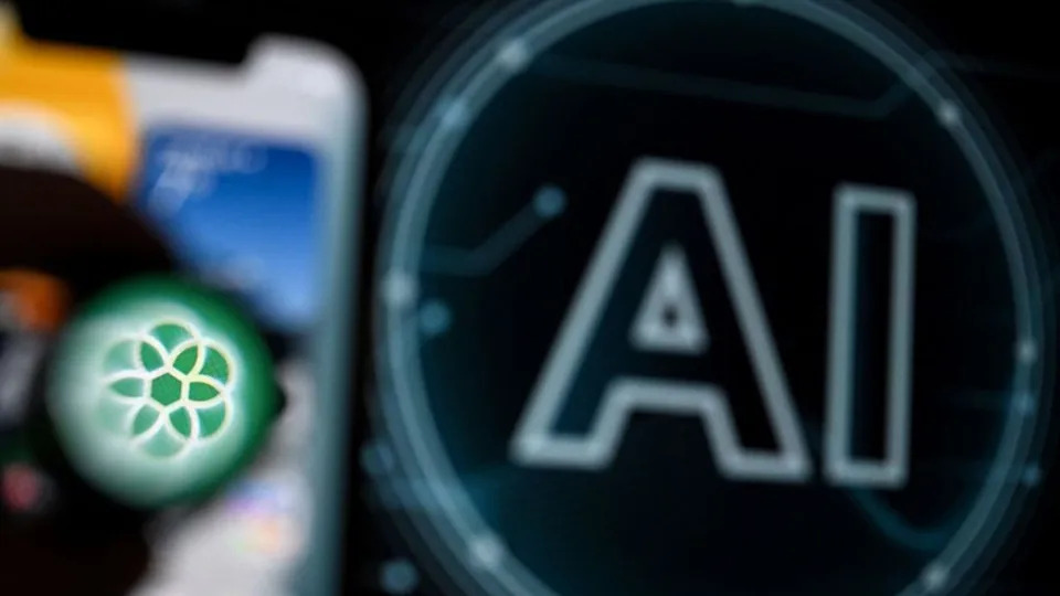 <div>A photo shows the logo of the ChatGPT application developed by US artificial intelligence research organization OpenAI on a smartphone screen (L) and the letters AI appear on a laptop screen. (Photo by KIRILL KUDRYAVTSEV/AFP via Getty Images)</div>