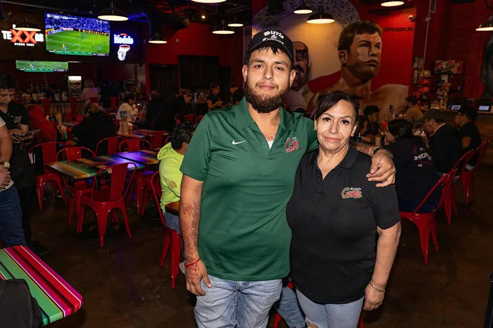 Owner Rogelio Cortez Jr., left, and his mother Patricia are photographed in the main dining room at Birrieria y Taqueria Cortez in Fort Worth on Wednesday, Nov. 20, 2024. The family plans to open a sister seafood concept before the summer of 2026.