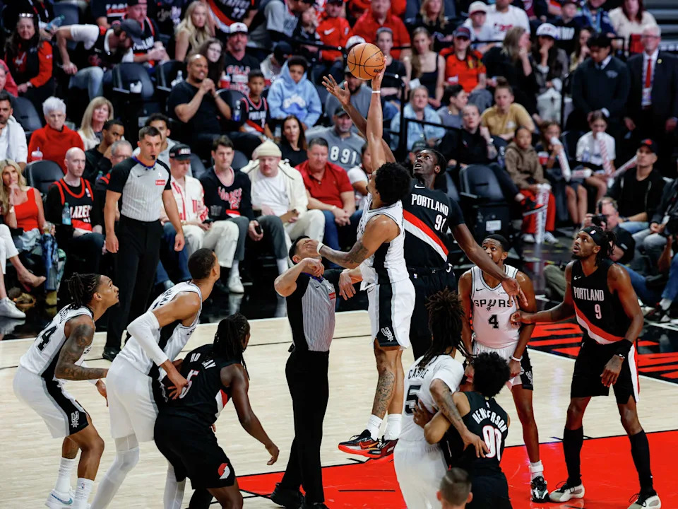 San Antonio Spurs guard Dylan Harper (2) wins a jump ball over Portland Trail Blazers guard <a class="link " href="https://sports.yahoo.com/nba/players/10051/" data-i13n="sec:content-canvas;subsec:anchor_text;elm:context_link" data-ylk="slk:Sidy Cissoko;sec:content-canvas;subsec:anchor_text;elm:context_link;itc:0" data-yga="{"yLinkElement":"context_link","yModuleName":"content-canvas","yLinkText":"Sidy Cissoko","ySubModuleName":"anchor_text","yHasCommerce":false}">Sidy Cissoko</a> (91) during the fourth quarter of Game 4 of a first-round NBA playoff series at Moda Center on Sunday, April 26, 2026. The Spurs won 114-93, leading the series 3-1. (Sam Owens/San Antonio Express-News)