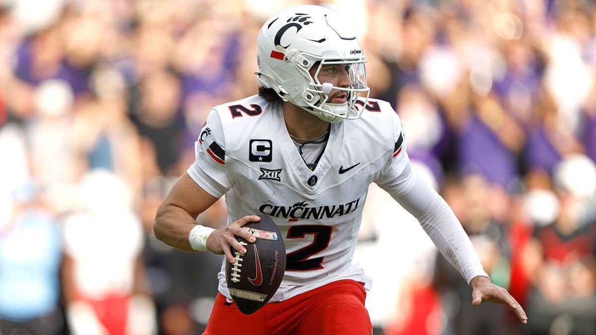 Brendan Sorsby scrambling during a football game at Amon G. Carter Stadium