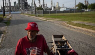Gavino Rivera talks about the decline of the Hillcrest neighborhood Thursday, Nov. 16, 2023, as he gathers scrap metal near a Citgo oil refinery in Corpus Christi, Texas. (Jon Shapley/Houston Chronicle via AP)