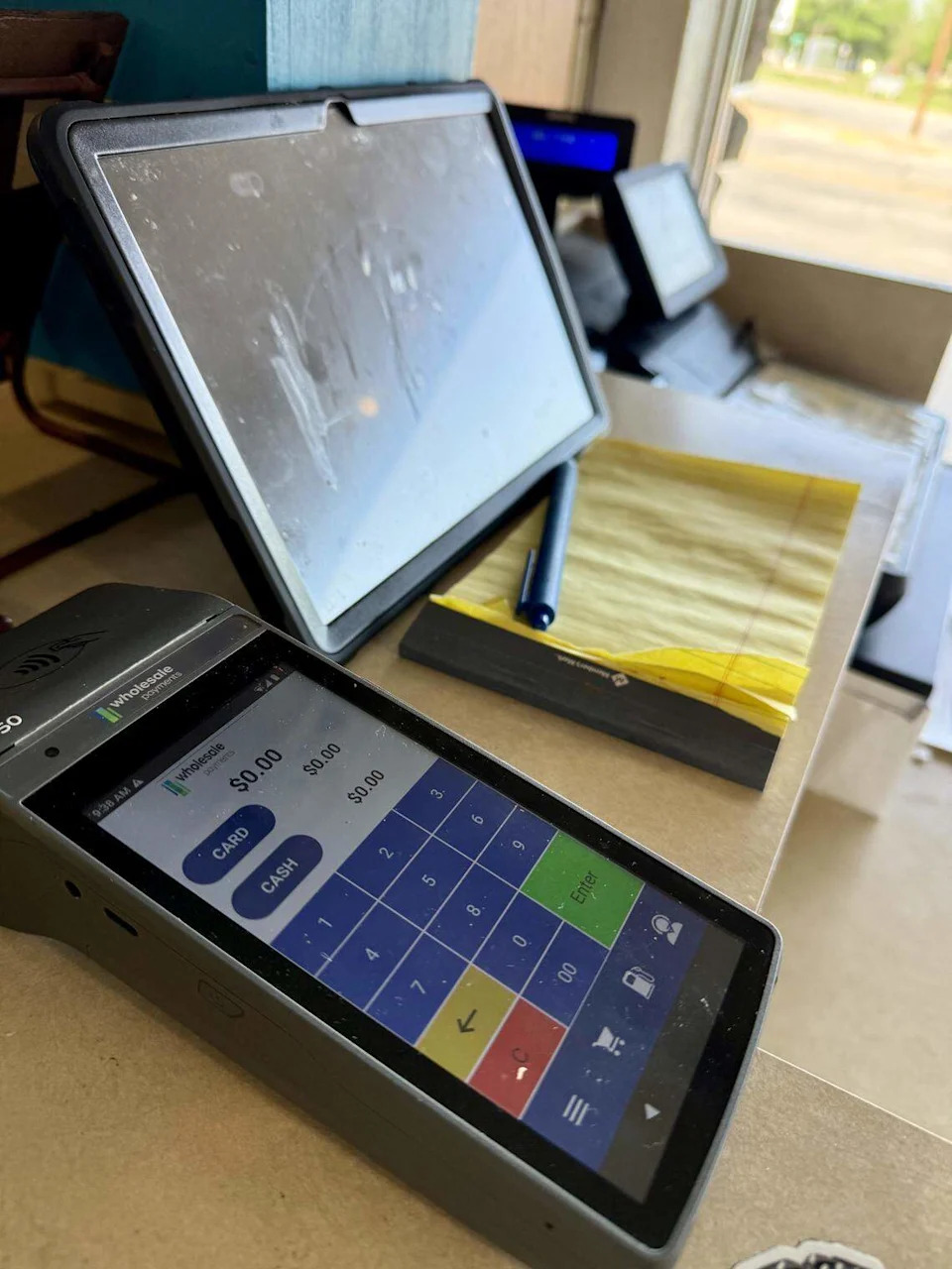 A new credit card machine seen April 16, 2026, at the checkout counter at Carshon’s Delicatessen, one of the last cash-only holdouts among Texas restaurants.