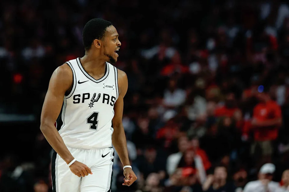 San Antonio Spurs guard De'aaron Fox (4) reacts after making a 3-pointer during the third quarter of Game 4 of a first-round NBA playoff series against the Portland Trail Blazers at Moda Center on Sunday, April 26, 2026. (Sam Owens/San Antonio Express-News)