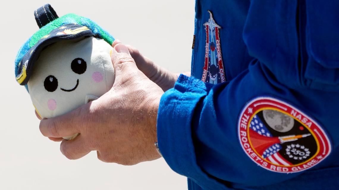 Artemis II commander brings beloved 'Rise' plush on journey back to Houston
