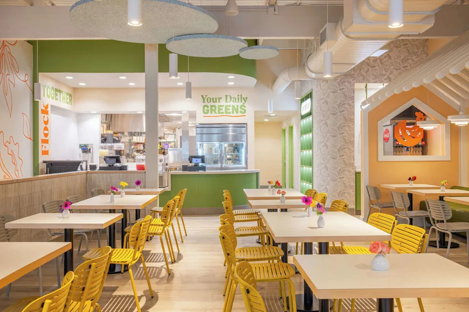 Flock and Fresh is designed with "soft" colors like pink, orange and green, said founder Wan Kim. He points to more "masculine" designs at Raising Cane’s and Wingstop to illustrate how he believes Flock and Fresh looks different. (White Unicorn Agency)