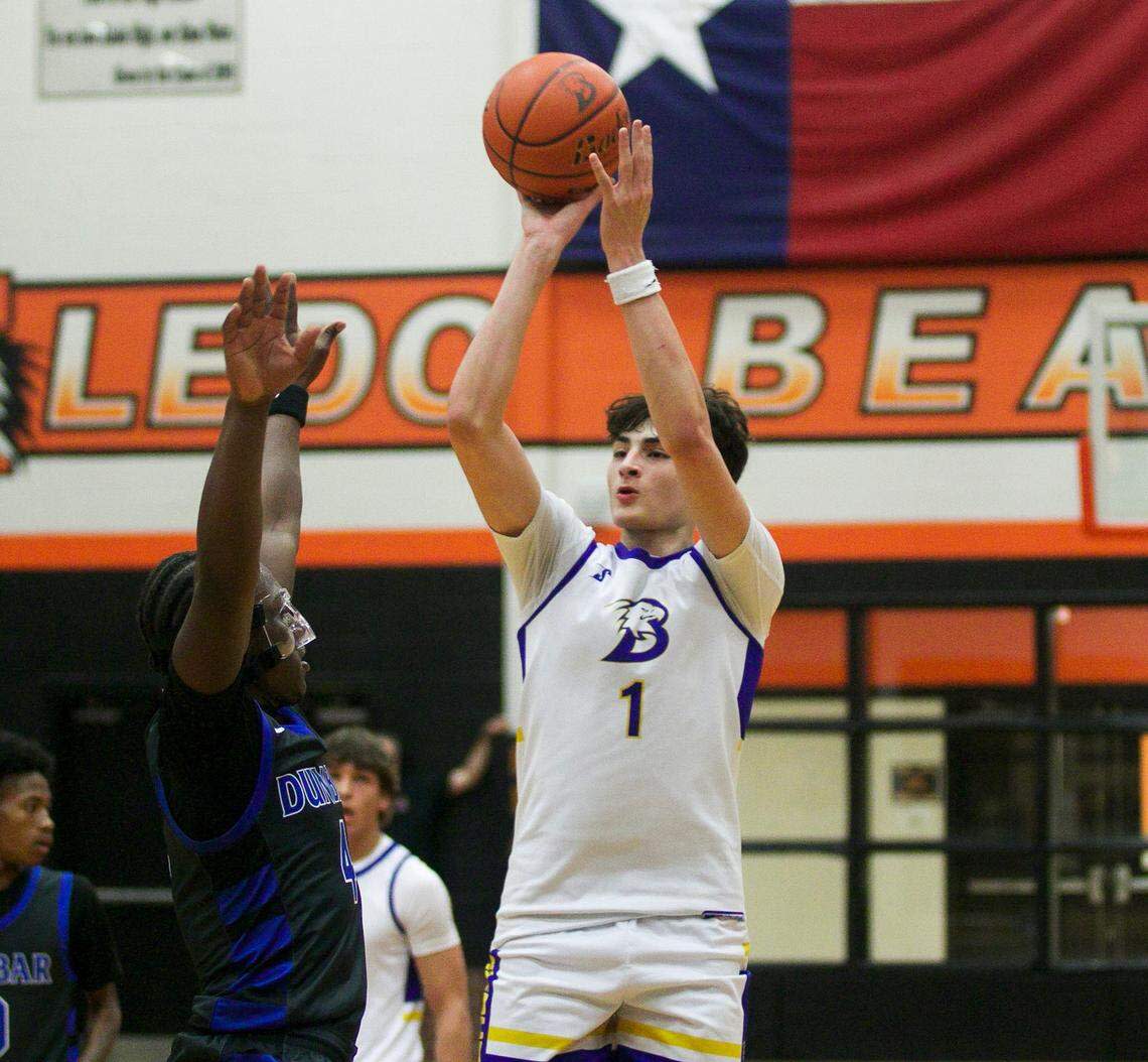 Brock’s Eli Paez shoots over Fort Worth Dunbar’s Dreyon Crear in a Class 4A Division II area playoff game Feb. 26 at Aledo.