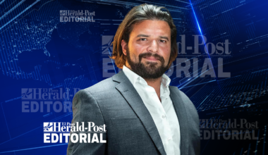 A picture of Brandon Herrera on a blue texture background.