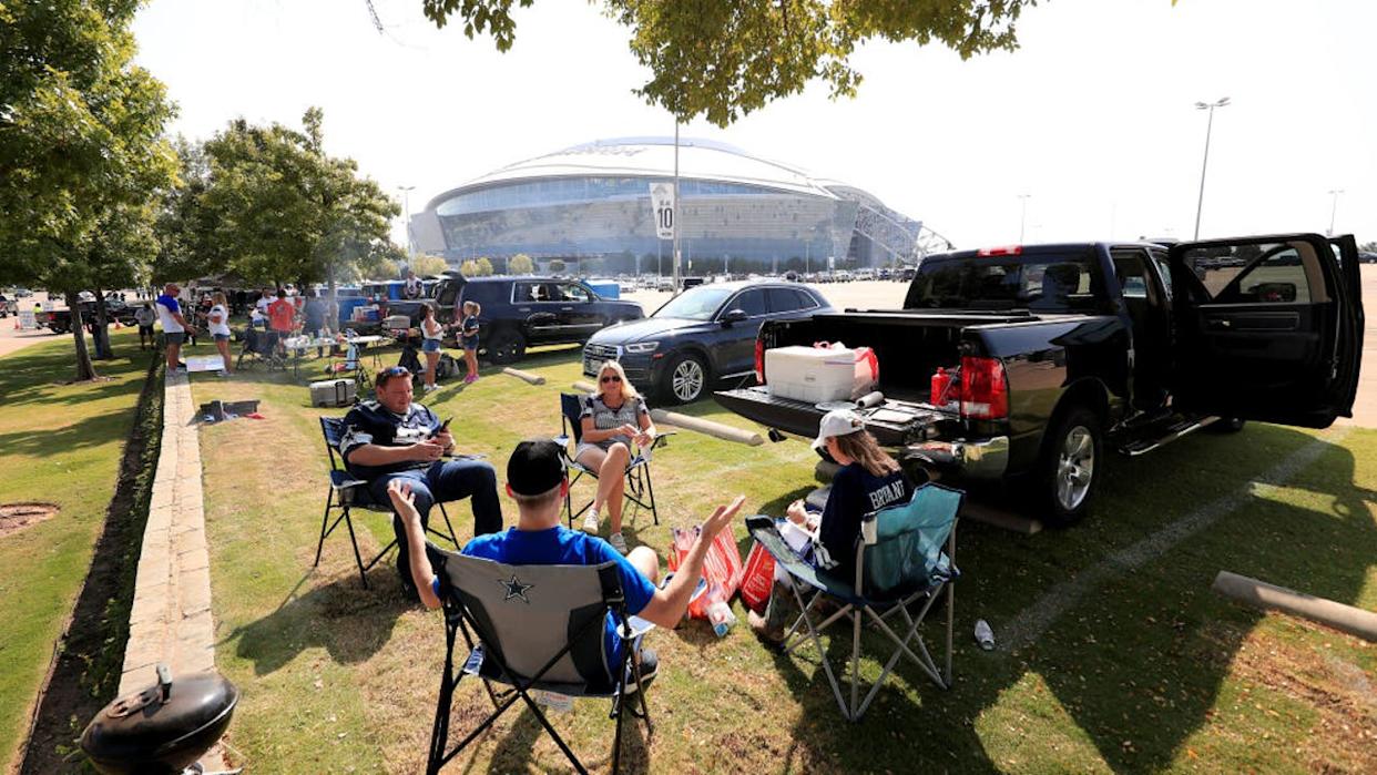 <div>ARLINGTON, TEXAS - SEPTEMBER 20: Fans tailgate in the parking lot before the Dallas Cowboys take on the Atlanta Falcons at AT&T Stadium on September 20, 2020 in Arlington, Texas. (Photo by Tom Pennington/Getty Images)</div>