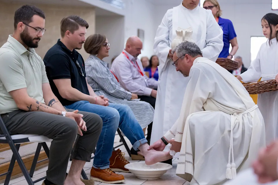 Rev. Mike Lewis washes Mason Thompson’s foot during the washing of the feet at Holy Thursday Mass at Most Holy Trinity Catholic Church on April 2, 2026, in El Paso, Texas.