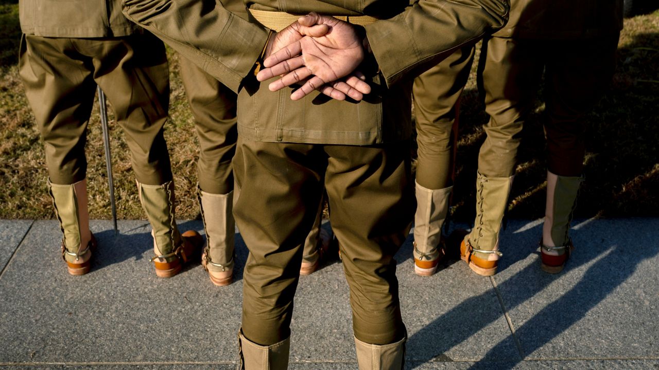 The Army’s 1st Cavalry Division Honor Guard from Fort Hood, Texas stands during a Veterans Day ceremony at the World War II Memorial in Washington(AP Photo/Andrew Harnik)