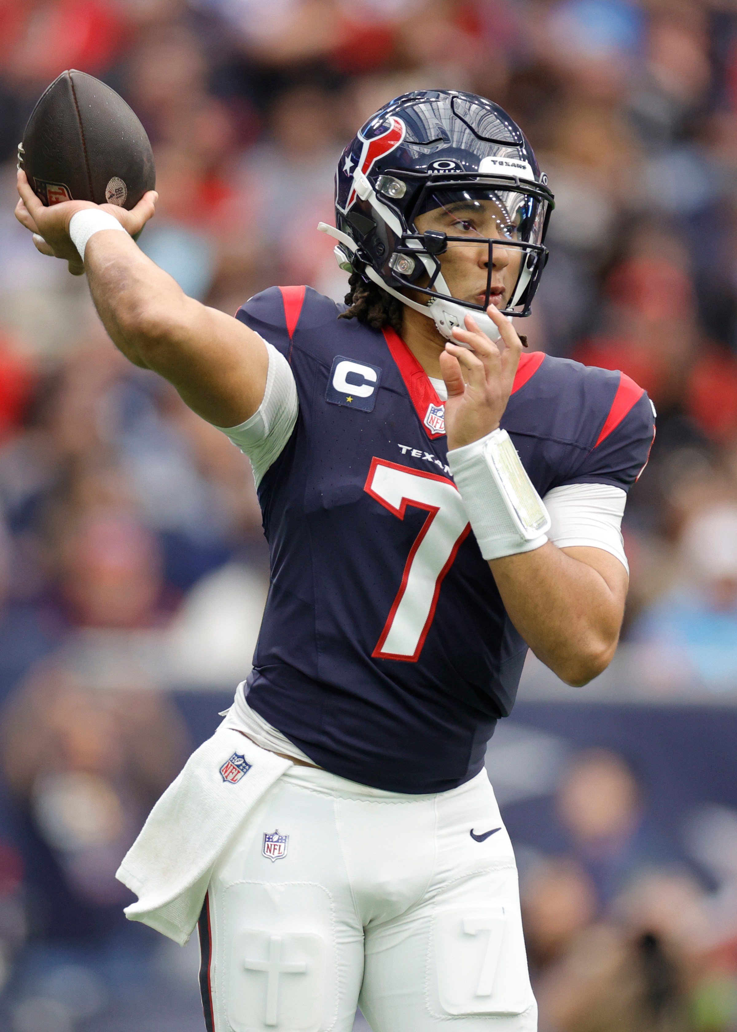 HOUSTON, TEXAS - DECEMBER 31: C.J. Stroud #7 of the Houston Texans in action against the Tennessee Titans at NRG Stadium on December 31, 2023 in Houston, Texas. (Photo by Carmen Mandato/Getty Images)