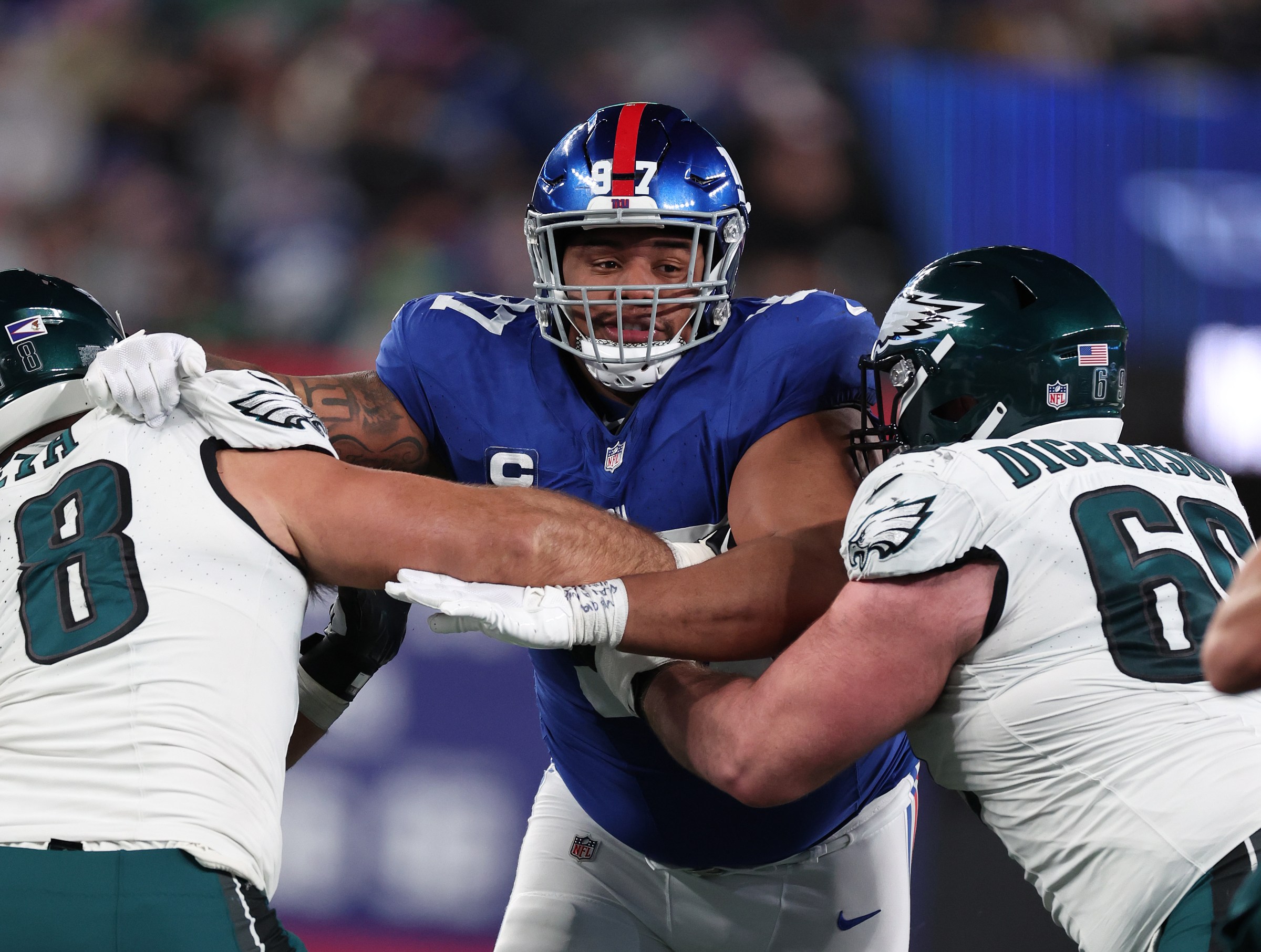 EAST RUTHERFORD, NEW JERSEY - JANUARY 07: Dexter Lawrence II #97 of the New York Giants in action against Sua Opeta #78 and Landon Dickerson #69 of the Philadelphia Eagles during their game at MetLife Stadium on January 07, 2024 in East Rutherford, New Jersey. (Photo by Al Bello/Getty Images)