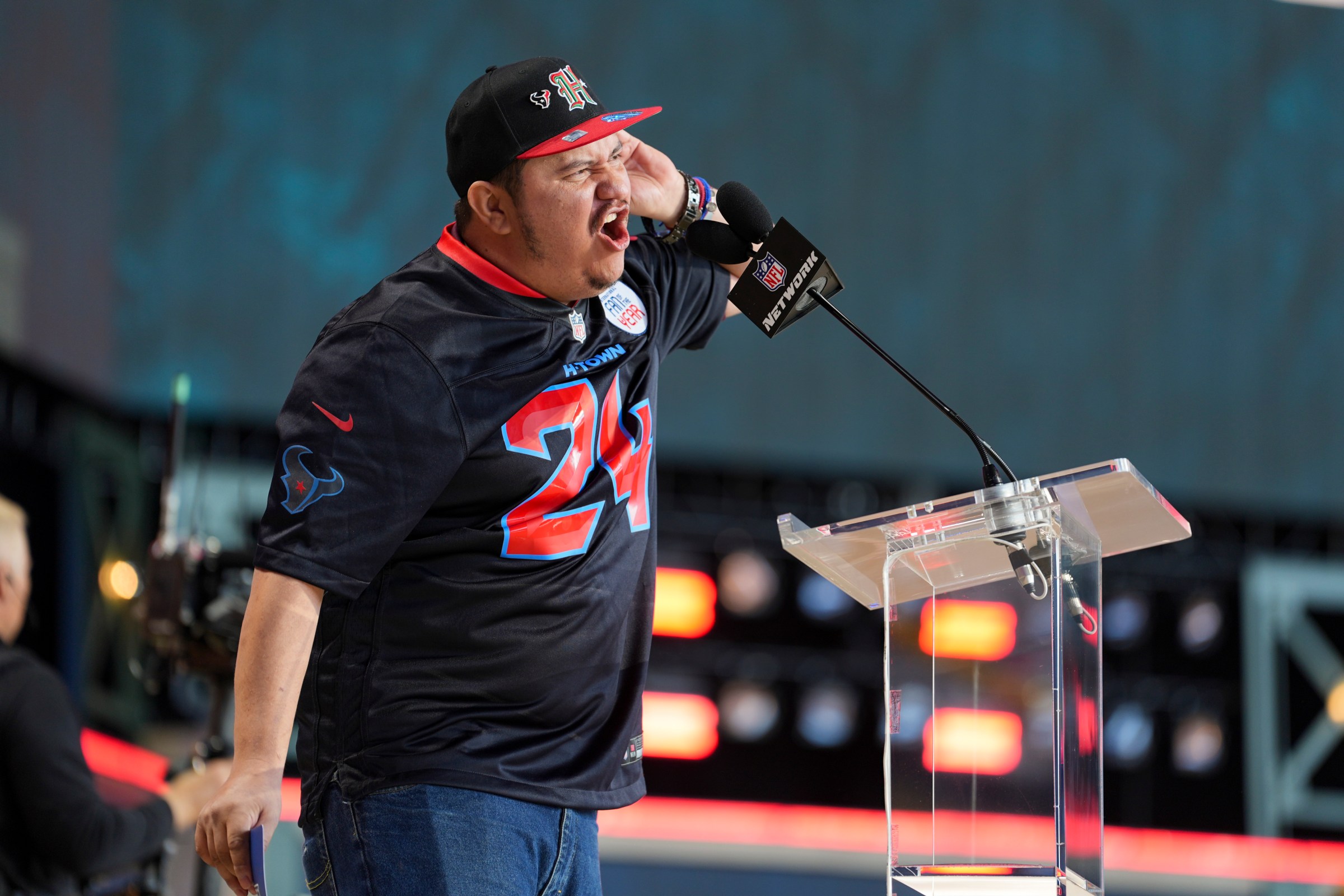 GREEN BAY, WISCONSIN - APRIL 26: Houston Texans international fan of the year announces a pick during the during the third day of the 2025 NFL Draft on April 26, 2025 in Green Bay, Wisconsin. (Photo by Perry Knotts/Getty Images)