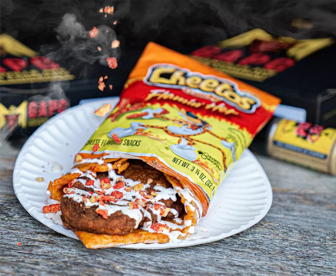 The Doobie from Greenville Ave. Pizza Co is a slice of cheese pizza with fried chicken and cheetos on top.