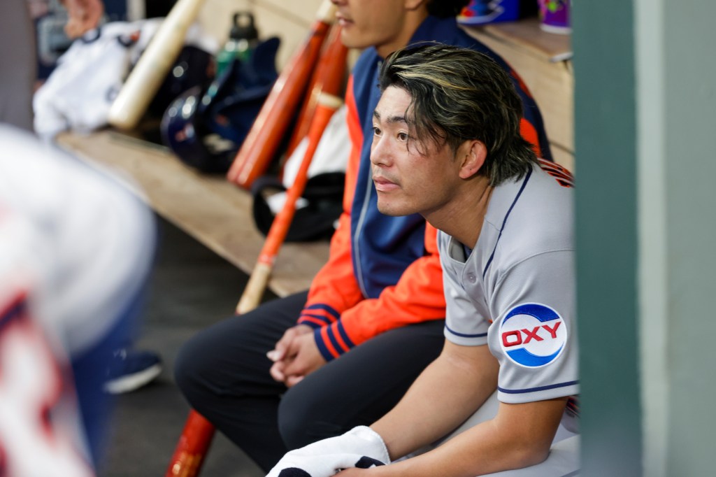 Houston Astros starting pitcher Tatsuya Imai sitting in the dugout.