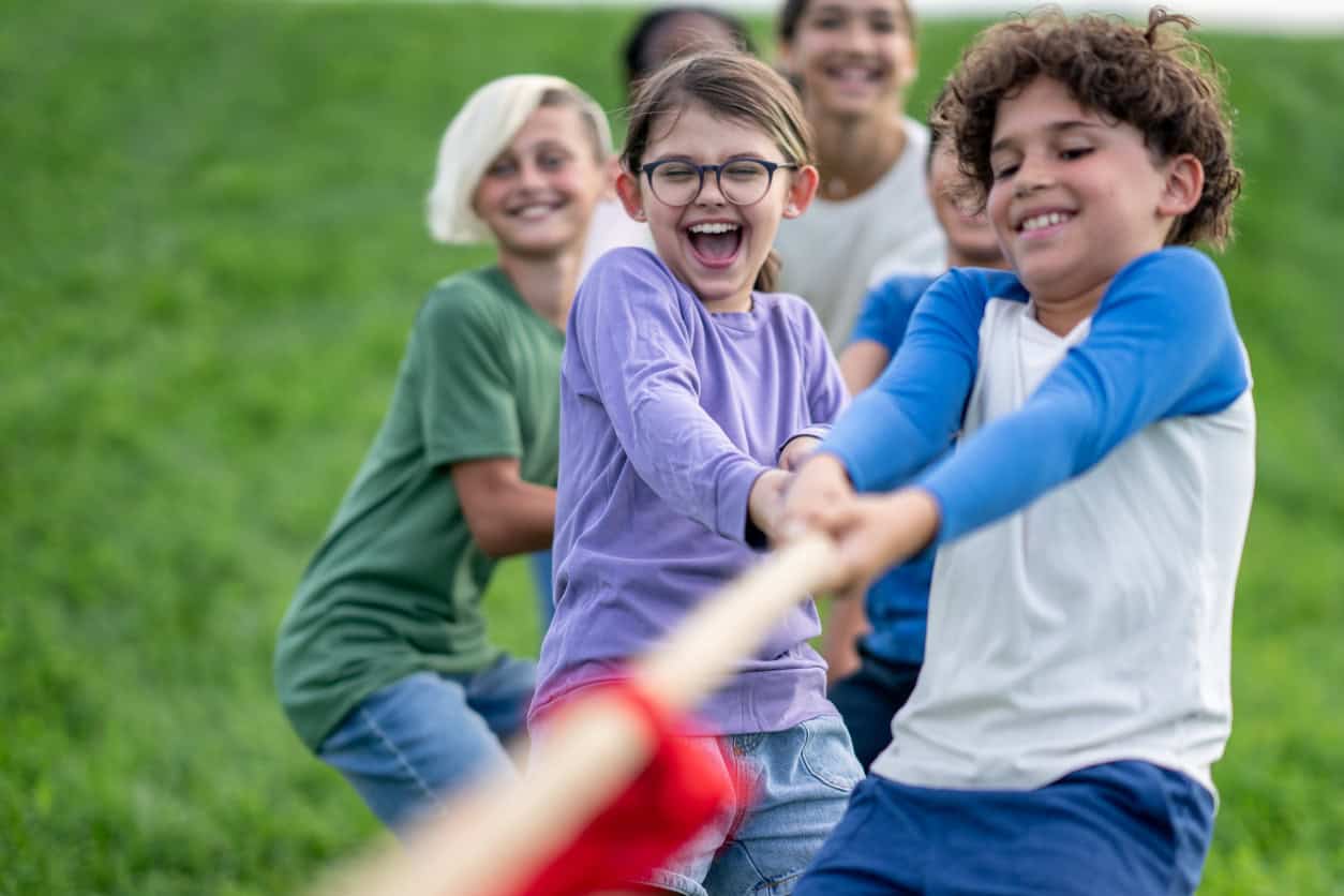 Kids playing tug-of-war at summer camp in Collin County for 2026.