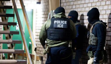 U.S. Immigration and Customs Enforcement officers wait to detain a person, Monday, Jan. 27, 2025, in Silver Spring, Md. (AP Photo/Alex Brandon, File)