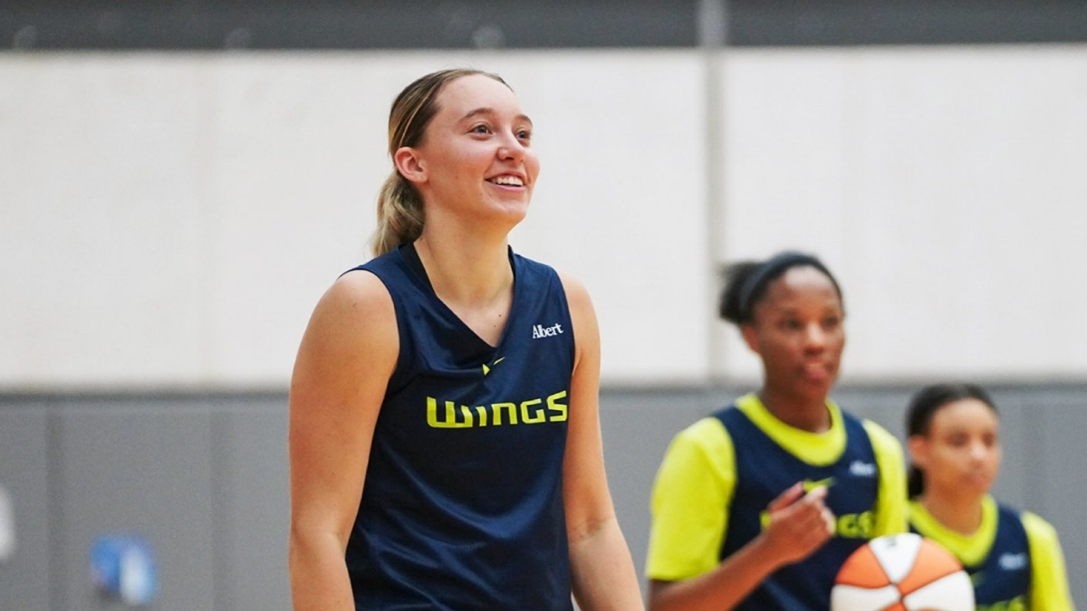 Dallas Wings guard Paige Bueckers handles the ball during a team drill on the opening day of 2026 training camp in Arlington.