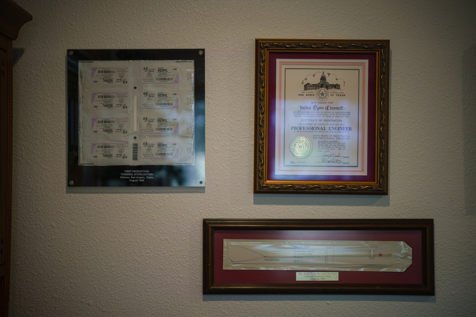 A certifcate showing Jackie Lynn Chestnutt’s registration as a professional engineer is hung next to other relics from her career in her office at her home in Knickerbocker, Texas on Tuesday, November 18, 2025. Chesnutt has fought to rehabilitate her property southwest of San Angelo for years, after discovering numerous leaking oil wells that do not produce anymore.