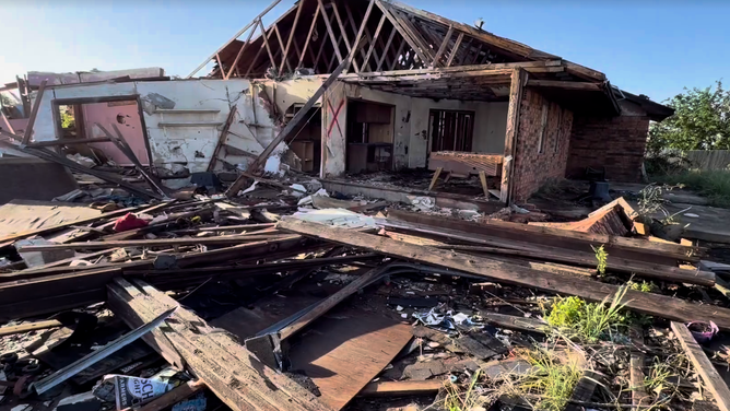A damaged home following a tornado in Enid, Oklahoma.