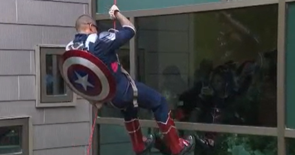 APD officers, healthcare workers rappel down Dell Children's dressed as superheroes