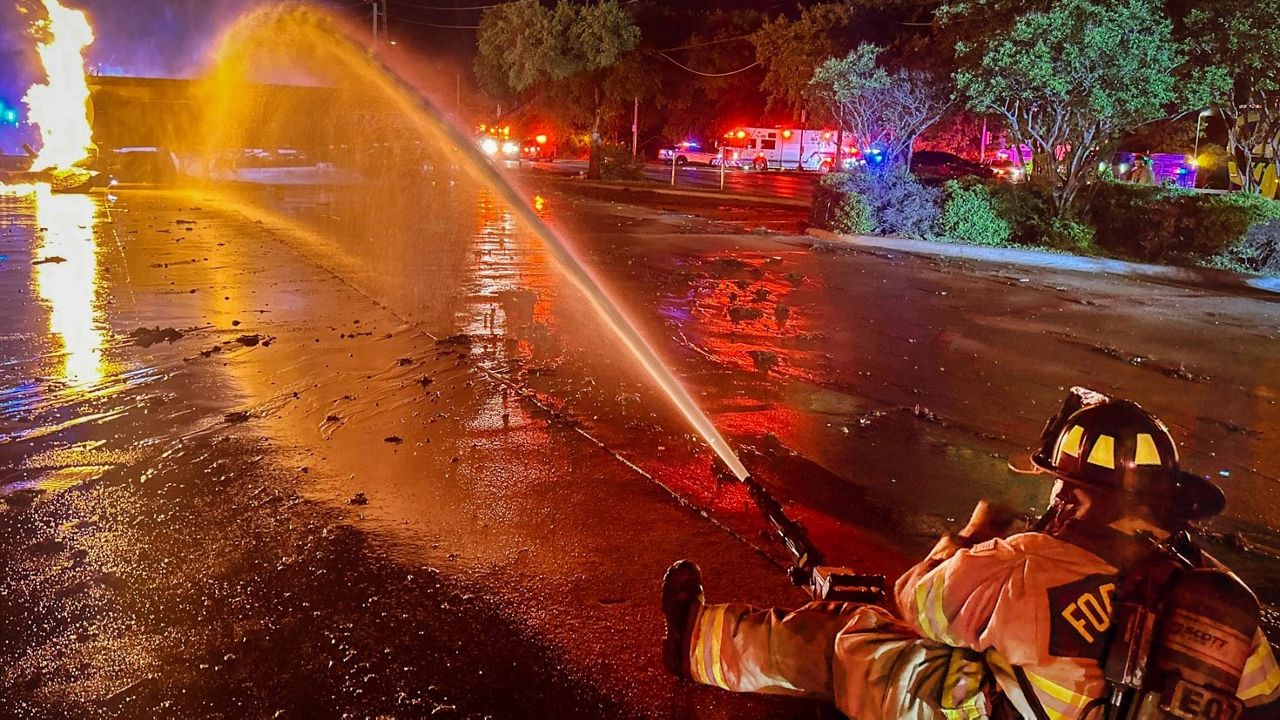 Firefighter puts out a tanker fire in Fort Worth, Texas. (Credit: Craig Trojacek/Fort Worth Fire Department)