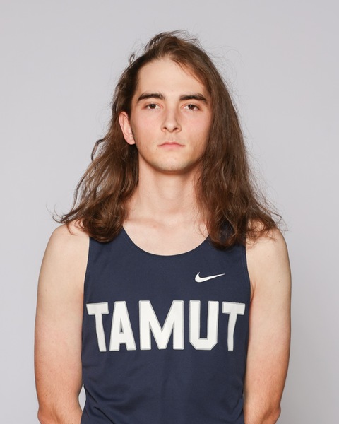 Graycen Vargo in a dark blue TAMUT tank top.