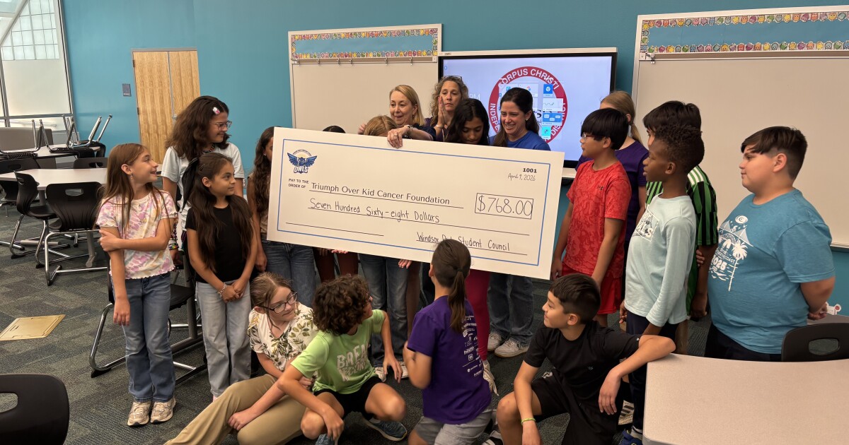 Windsor Park students present donation to Triumph Over Kid Cancer