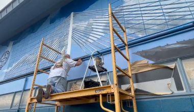 Another harbor bridge is being put together with paint and brushes