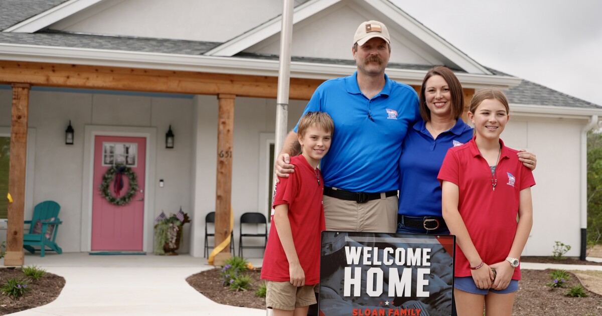 Injured Army veteran and his family receive a new mortgage-free home