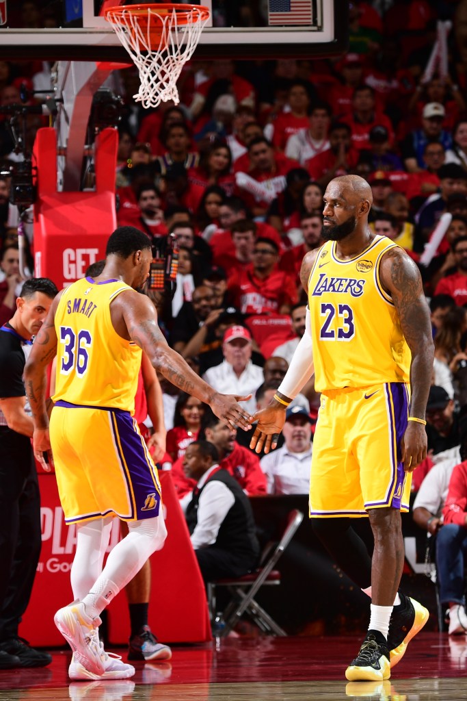 LeBron James high-fives Marcus Smart.
