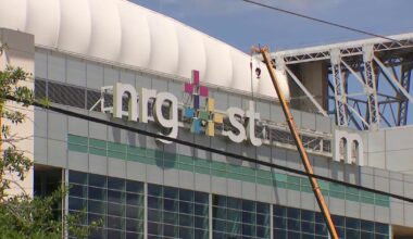 Why is the NRG Stadium sign being taken down in Houston?