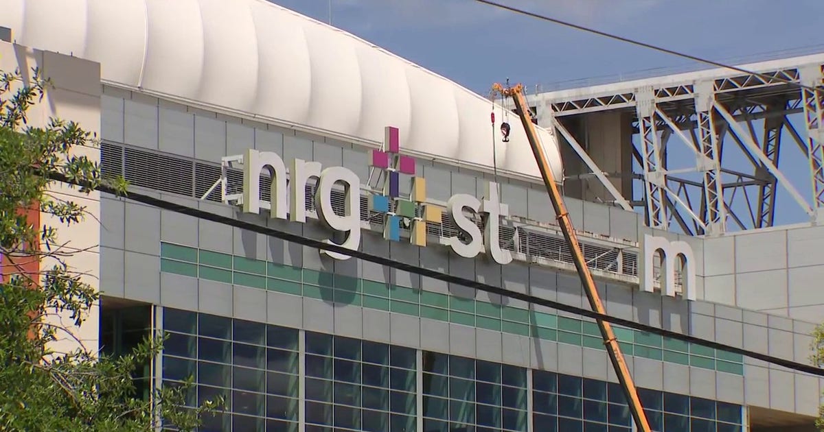 Why is the NRG Stadium sign being taken down in Houston?