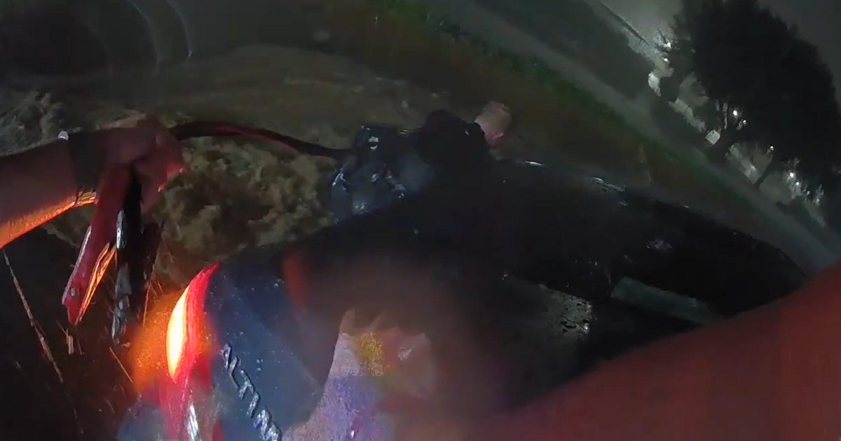 Footage shows North Texas officers rescue woman from car stranded by flood water